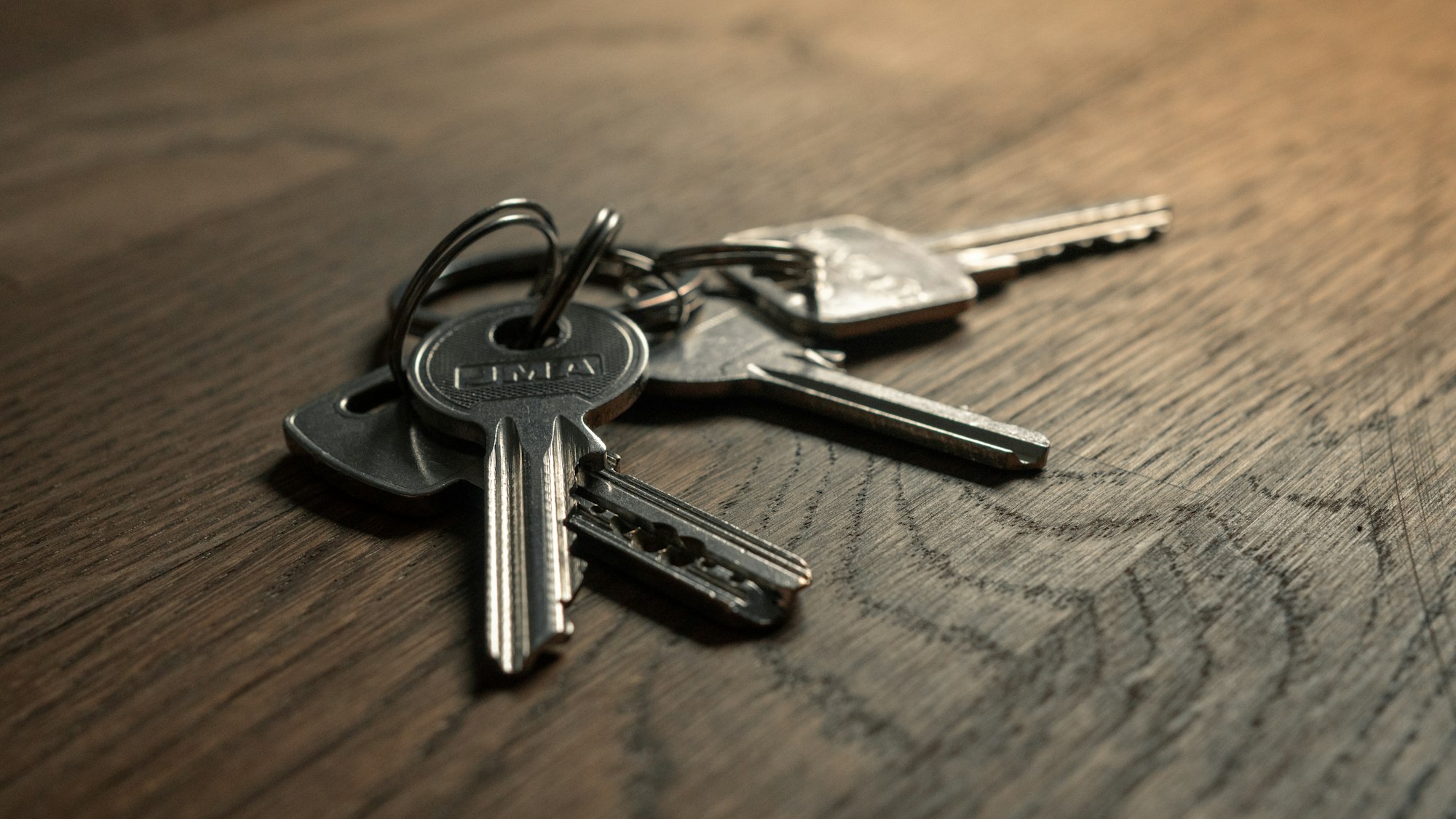 House keys resting on a wooden table